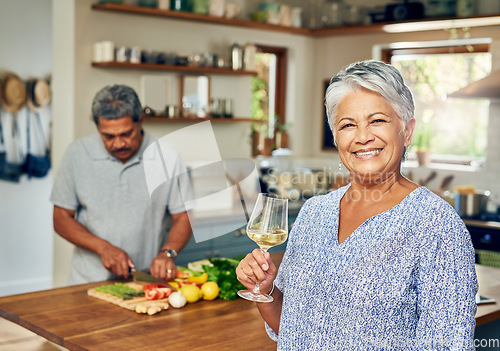 Image of Portrait of old woman in kitchen with man, wine and cooking healthy food together in home. Bonding, smile and senior couple in house with meal prep, happiness and drinks to relax in retirement time.