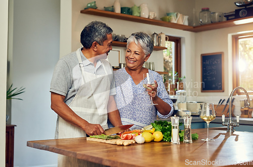 Image of Love, cooking and old couple with wine in kitchen, healthy food and marriage bonding together in home. Drink, glass and senior woman with man, meal prep and vegetables for wellness diet in retirement