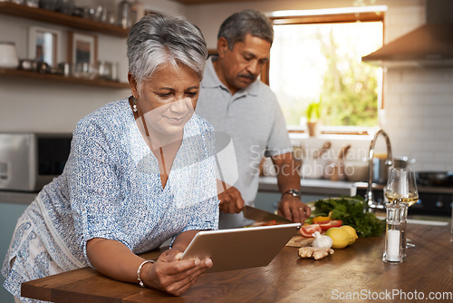 Image of Senior couple, tablet and cooking in kitchen with healthy food, online search and app for nutrition in home. Digital recipe, old woman and man in house with meal prep, wellness and retirement diet.