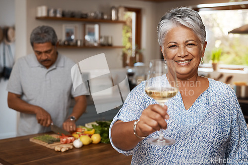 Image of Portrait of old couple in kitchen, wine and cooking, cheers to healthy food together in home. Toast, smile and senior woman with glass in house with man, meal prep and happy lunch diet in retirement