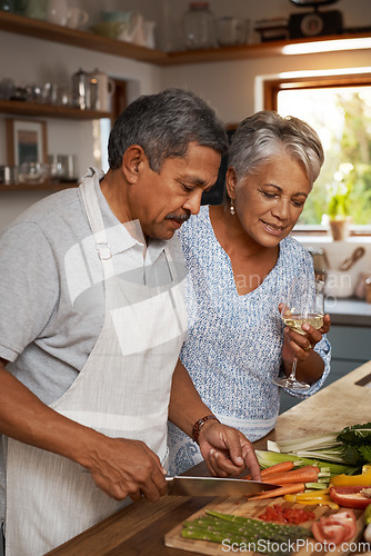 Image of Vegetables, cooking and old couple with wine in kitchen, healthy food and marriage time together in home for dinner. Drink, glass and senior woman with man, meal prep and wellness diet in retirement.