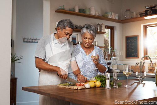 Image of Vegetables, cooking and senior couple with wine in kitchen, healthy food and marriage bonding together in home. Drink, glass and happy woman with old man, meal prep and wellness diet in retirement.