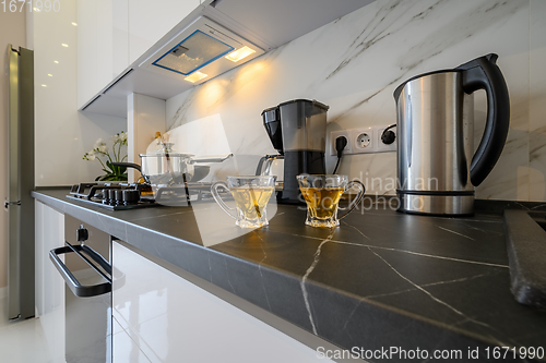 Image of Closeup to modern kitchen cupboard