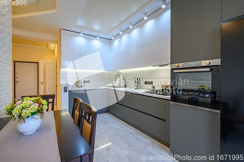 Image of Luxury white and dark grey modern kitchen interior