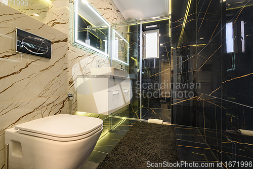 Image of Spacious bathroom in black and white tones