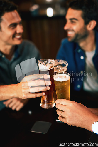 Image of Beer, cheers and man hands drinking with friends at social event in a restaurant with happiness. Alcohol, glasses and toast at a pub at happy hour with smile and talk with drinks and celebration