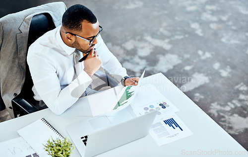 Image of Financial report, laptop and black business man in his office or finance analyst or data graph and employee on desk. Insight, fintech and professional on pc or technology or stock market and top view