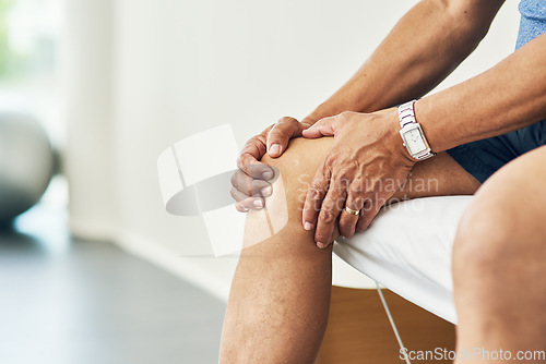 Image of Physiotherapy, knee pain and injury with legs of man in room for consulting, medical and arthritis. Rehabilitation, muscle and joint with closeup of patient in clinic for physical therapy and healing