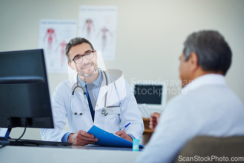 Image of Doctor, senior man and office consultation for healthcare service, writing notes and listening to health problem. Helping, advice and medical professional on folder, report and chart of patient care