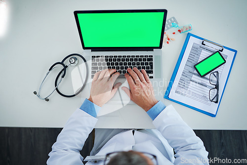 Image of Laptop, green screen and doctor hands with medicine, documents or healthcare service, research and mockup above. Space, telehealth and pills with medical person typing, phone mock up and computer app