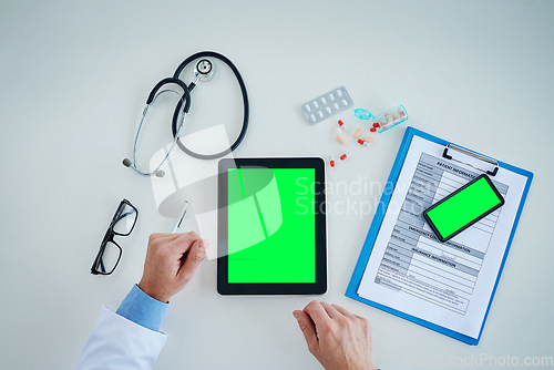 Image of Tablet, green screen and doctor hands with medicine, documents and healthcare service, research and mockup above. Mock up, space and paperwork, pills and medical person with telehealth application