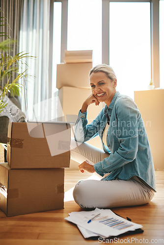 Image of Woman, boxes and portrait with document on the floor with a smile at a new home for investment. Property, box and paperwork with happiness for investing in real estate for finance and retirement.