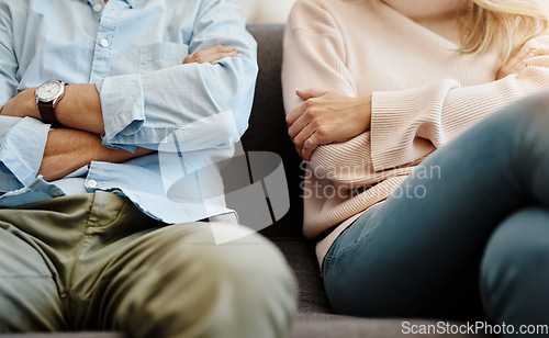 Image of Divorce, sad and couple fight due on a couch due to marriage problem or conflict in a lounge sofa. Anger, fail and angry people or partner frustrated in a living room due to cheating or argument