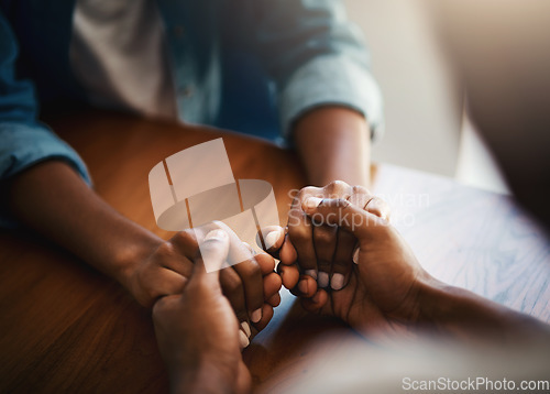 Image of Empathy, prayer and support with friends and holding hands for comfort, kindness and gratitude. Hope, help and trust with closeup of people at home for depression, praying and forgiveness