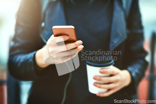 Image of Hands, coffee and phone for texting in city, internet scroll and web browsing. Cellphone, hand and woman networking, online social media and messaging, website and mobile app outdoor on urban street.