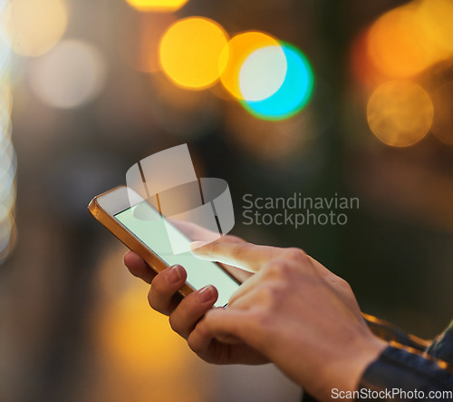 Image of Hands, bokeh and phone screen in city, internet scroll and web browsing at night mockup space. Cellphone, hand closeup and woman networking, online social media and typing on mobile app for email.