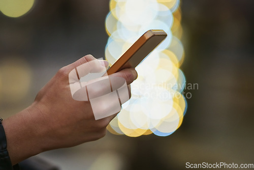 Image of Hands, bokeh and phone for typing in city, internet scroll and web browsing at night mockup space. Cellphone, hand closeup and woman networking, online social media and mobile texting in urban street