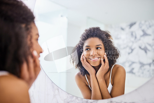 Image of Woman, skin and mirror in the bathroom with glow in the morning for facial treatment at home. Model, skincare and beauty with smile for self care with dermatology, reflection and happiness at home.