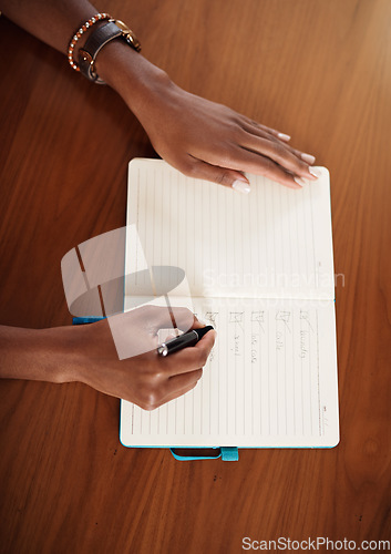 Image of Checklist, notebook and hands of woman writing in book for planning, organization and to do list at home. Brainstorming, notes and above of female person write goals, agenda and schedule in journal