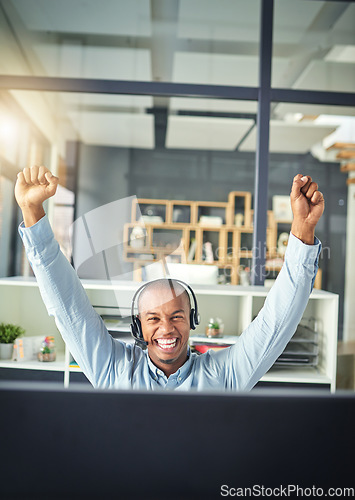 Image of Call center, celebration and happy black man winning in office for consulting, sale success and communication. Telemarketing, winner and male consultant for customer service, crm support and network