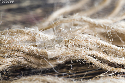 Image of broken and untangled thick linen rope