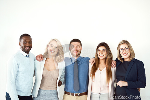 Image of Collaboration, portrait and smile of lawyers by white wall background or mockup in workplace. Confident face, law group and business people standing together with teamwork, diversity and cooperation.