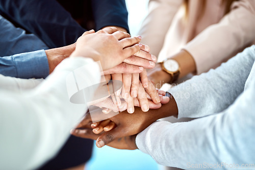 Image of Team building, collaboration or hands of business people in stack for, partnership, support or community mission. Motivation or closeup of corporate group of workers with goals or target in meeting