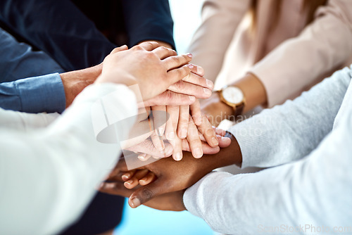 Image of Team building, support or hands of business people in huddle for, partnership, support or community mission. Trust, motivation or closeup of corporate group of workers with goals or target in meeting