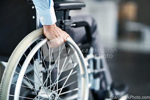 Image of Wheelchair, disability and man hand holding wheel in a hospital for healthcare. Disabled, mobility problem and male person in a clinic for support and medical care with hands of patient and mockup