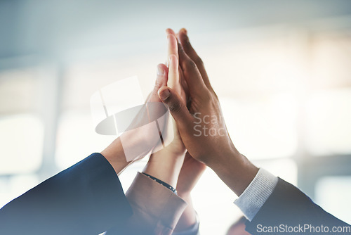 Image of Business people, closeup high five and group for teamwork, support or mission for goal in insurance company. Team building, hands and connection with synergy, solidarity or collaboration in workplace