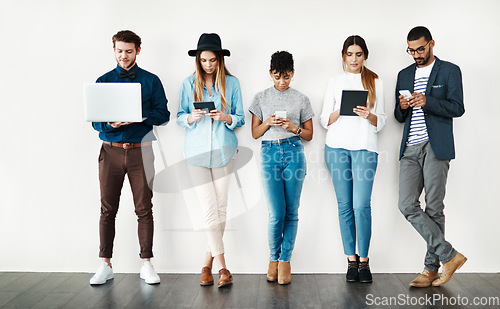 Image of Diversity, connection and people on social media, online networking or digital communication on technology. Group, wireless connectivity and talking on phone, laptop or tablet and mockup background