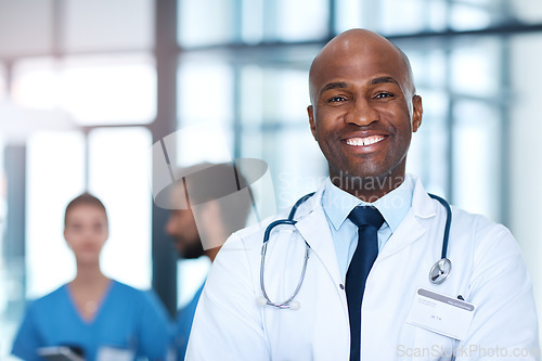 Image of Man, leader and portrait of doctor in hospital, healthcare or clinic with medical expert nurses to trust in quality care. Black person, face and happy cardio surgeon with confidence in medicine