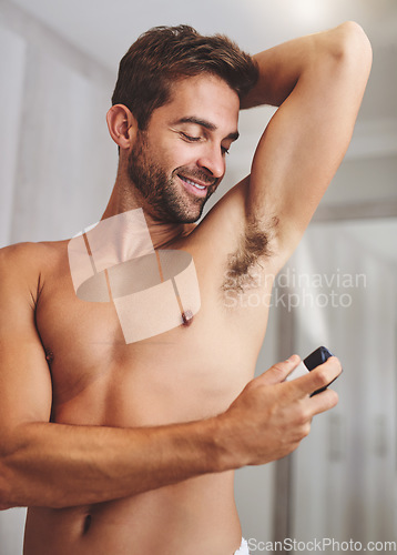 Image of Deodorant, clean spray and man in bathroom for hygiene, shower and perfume to control underarm sweating. Happy shirtless guy, armpit and fragrance cosmetics for skincare, body product and male beauty