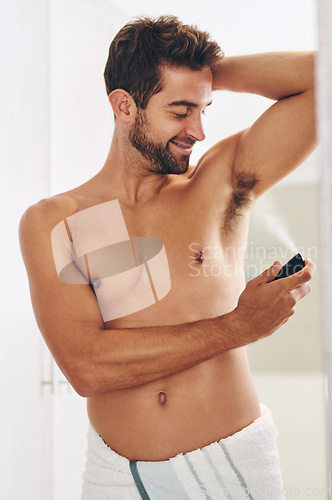 Image of Deodorant, body spray and man in bathroom for hygiene, shower and perfume to control sweating. Happy shirtless guy cleaning armpit with fragrance cosmetics, mist and skincare product for male beauty