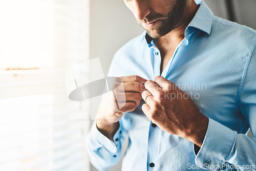 Image of Hands, man and button shirt of clothes for job interview, work event and corporate fashion for business. Closeup, male person and ready in professional outfit from wardrobe in the morning at home