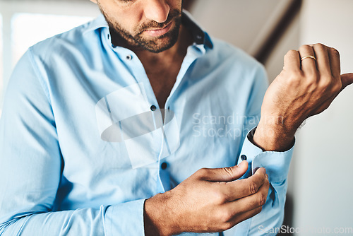 Image of Closeup, man and button cuff of shirt for job interview, work and corporate fashion for business. Hands, arm and male person getting ready in professional clothes from wardrobe in the morning at home