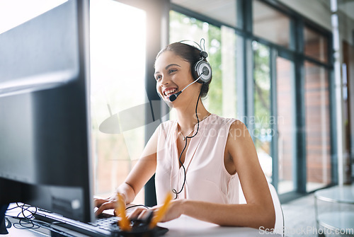 Image of Happy woman, call center and consulting on computer in customer support, service or telemarketing at office. Friendly female person, consultant or agent smiling for online advice or communication