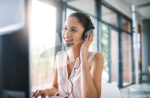 Image of Happy woman, call center and consulting with headphones in customer service, support or telemarketing at office. Friendly female person or consultant agent with smile and headset for online advice