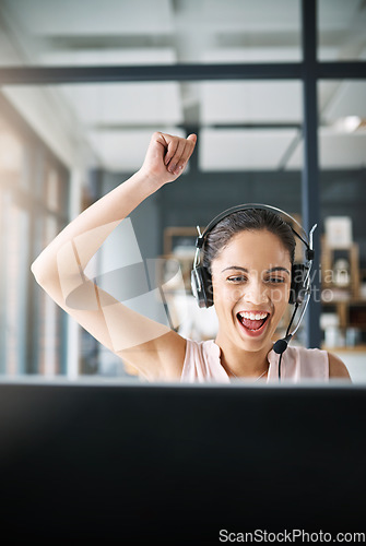 Image of Happy woman, call center and celebration for winning, success or promotion in customer service or telemarketing at the office. Excited female person or consultant agent winner in contact us or sale
