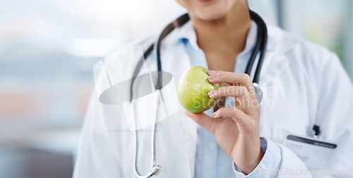 Image of Doctor, hands and woman with apple for healthy diet, nutrition or wellness. Medical professional, nutritionist or person with fruit for vitamin c, healthcare or natural food for vegan health benefits