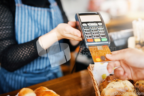 Image of Credit card payment, bakery and hands with a machine at a restaurant for a service or food. Cafe, pay and a customer paying or buying a product at a coffee shop with a transaction from a worker