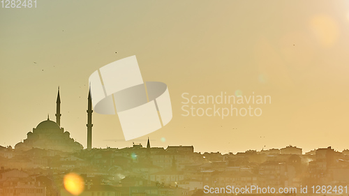 Image of Silhouette of a Mosque Fatih in a fog and sunlight reflections. Vintage style.