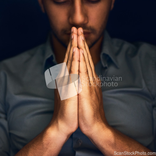 Image of God, worship and man with hands praying for help, hope and guidance in dark studio. Pray, thank you and Christian male in prayer for hope, gratitude and holy praise, faith or blessing to Jesus Christ