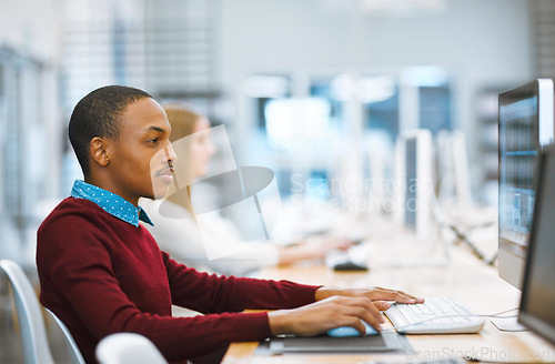 Image of Education, university and student in the library computer or studying on desktop or doing exams on the internet and in college. Research, learning and scholar reading or academic and online course