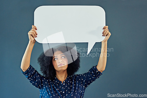 Image of Mockup, speech bubble and woman in studio with banner for news, social media or advertising on blue background. Space, billboard and female person with paper, poster and branding promotion or launch