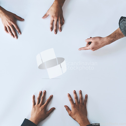 Image of Mockup, pointing and designer team planning together as teamwork or collaboration creative marketing idea for startup. Brainstorming, discussion and hands of corporate people in a development meeting