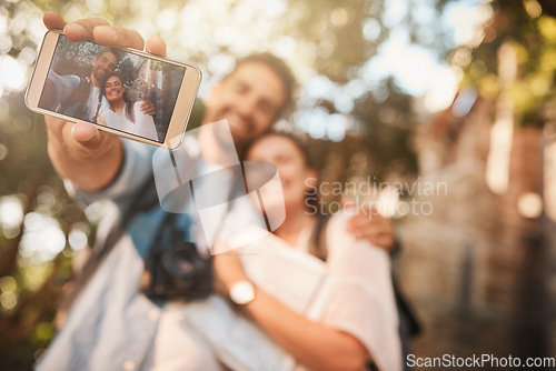 Image of Phone screen, couple and selfie outdoor for travel and vacation memory or happiness. Tourist man and woman happy about adventure, journey or holiday photo with freedom, love and care in nature