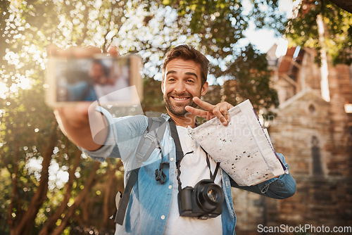 Image of Tourist, happy man and peace sign selfie outdoor in a city for travel holiday with memory, smile and happiness. Male person with hand emoji for adventure, journey or vacation photo and freedom