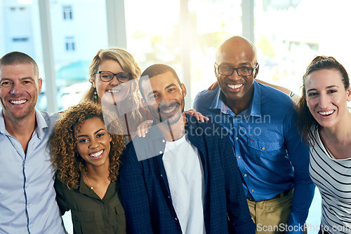 Image of Business people, portrait and hug in a office with a smile from friends with teamwork and collaboration. Diversity, happiness and writer staff together and feeling proud from motivation and success