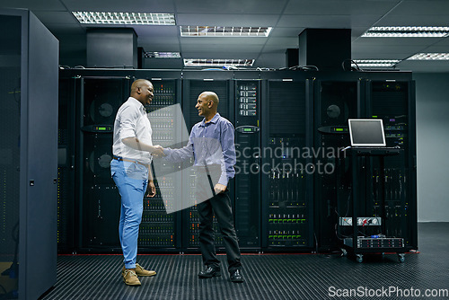 Image of Handshake, partnership or men in server room of data center worker with a thank you hand shake for help. B2b deal agreement, shaking hands or people in collaboration for network glitch or IT support